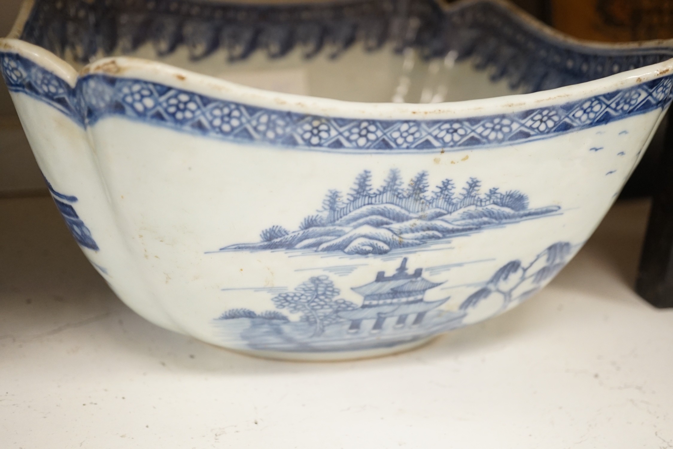 A selection of 18th century blue and white Chinese export bowls and dishes, largest 31cm diameter
